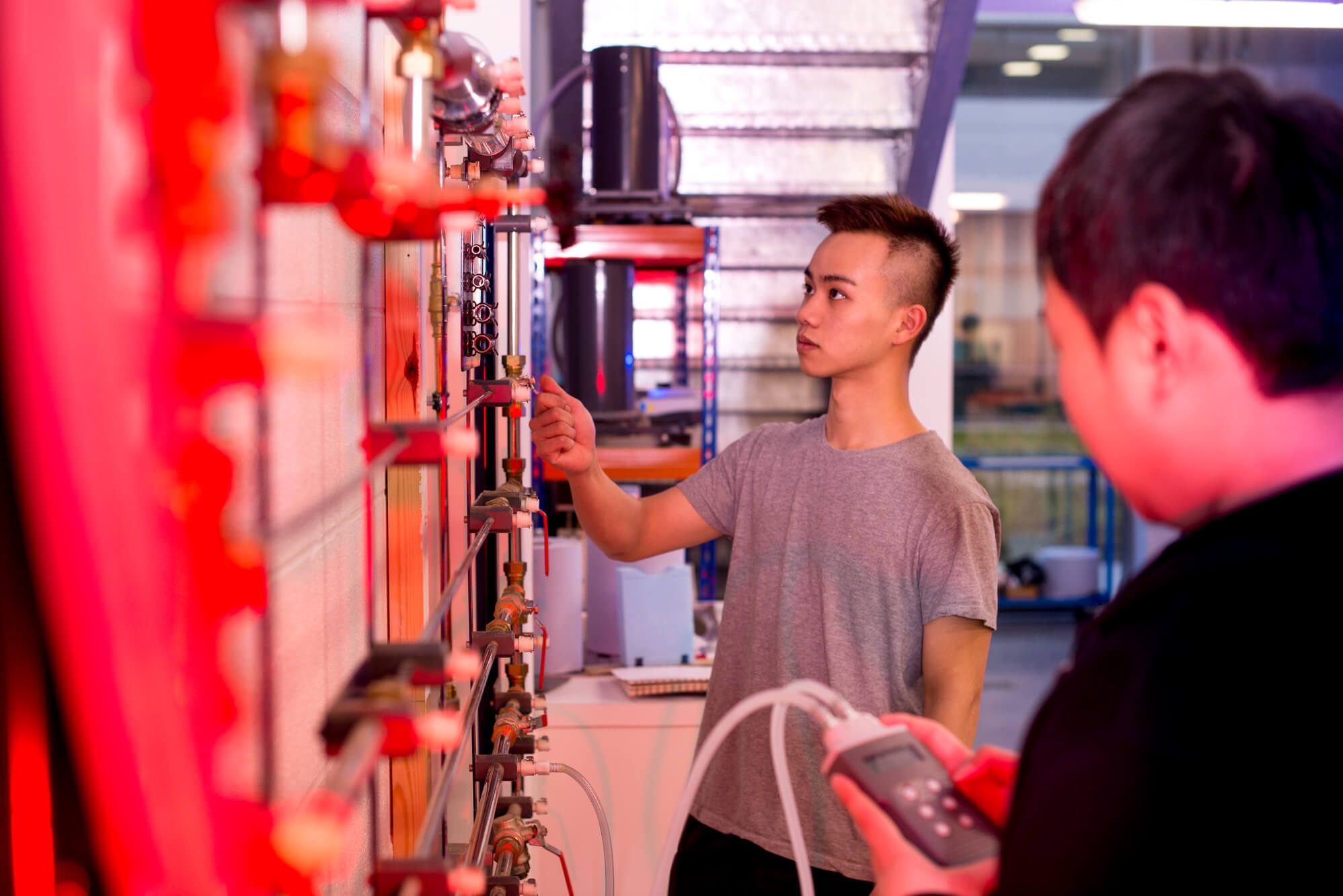Two people using fluids facilities at the University of Derby