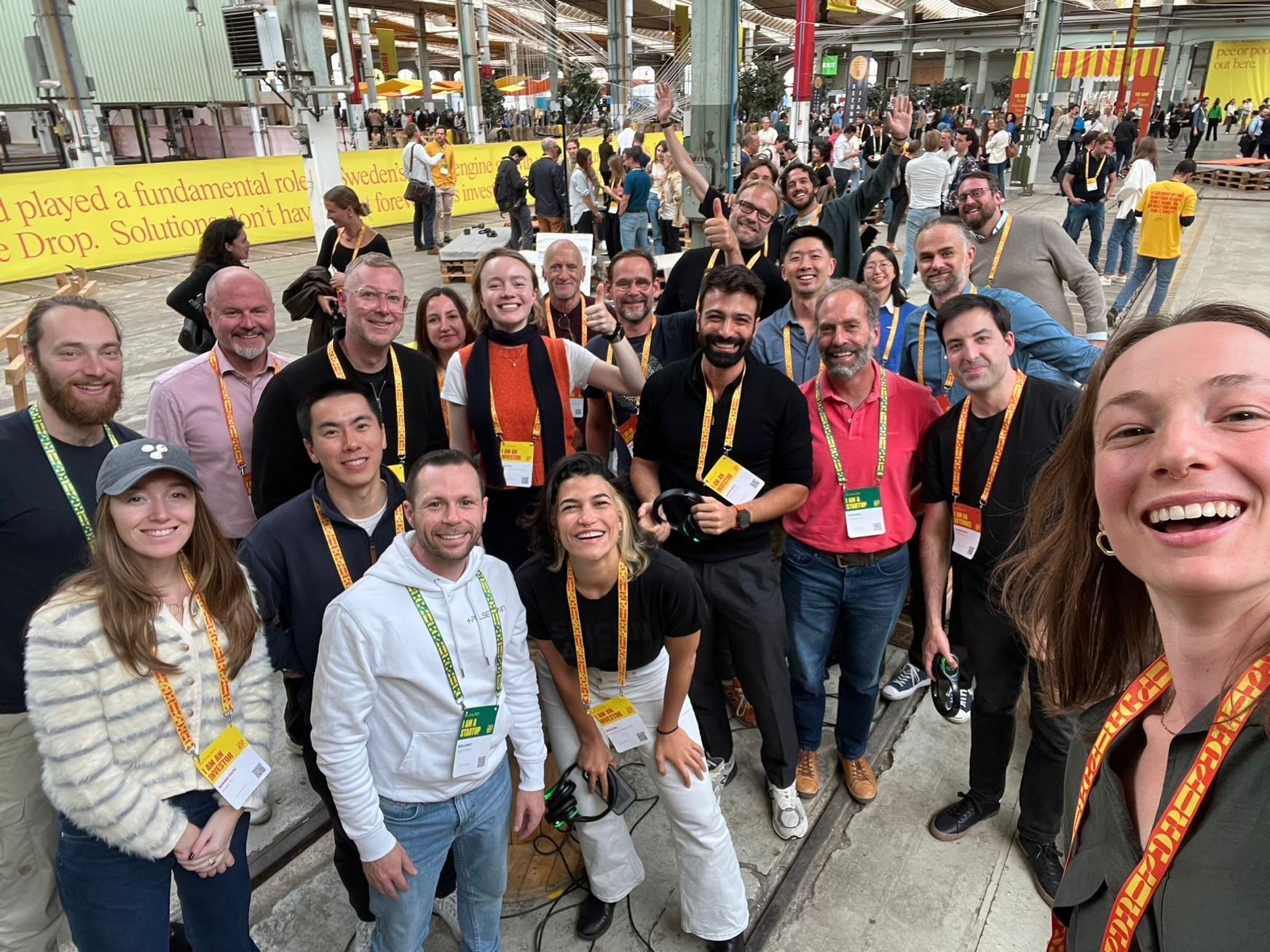 A group selfie of smiling participants at The Drop event