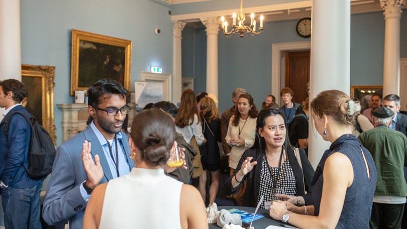 A room of people networking at the RI in London